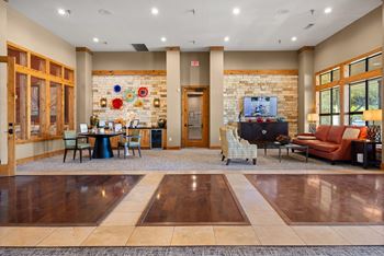 A room with a stone wall and a tv on it.
